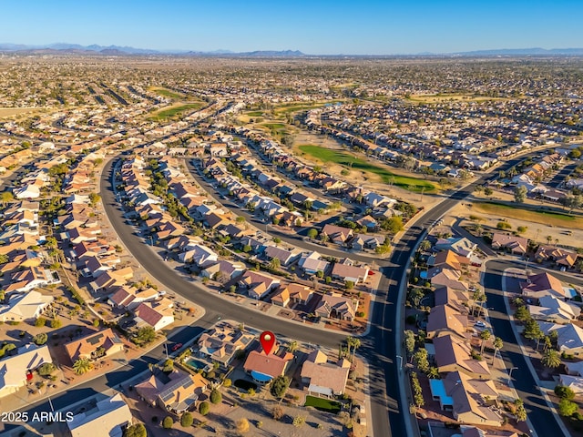 birds eye view of property with a mountain view