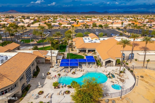 birds eye view of property with a mountain view