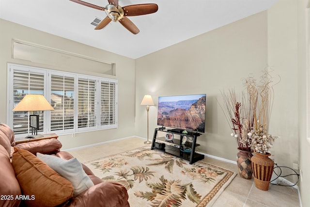 living room with ceiling fan and light tile patterned floors