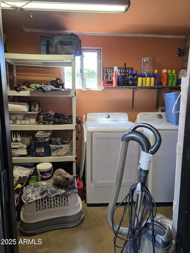 washroom with washing machine and clothes dryer