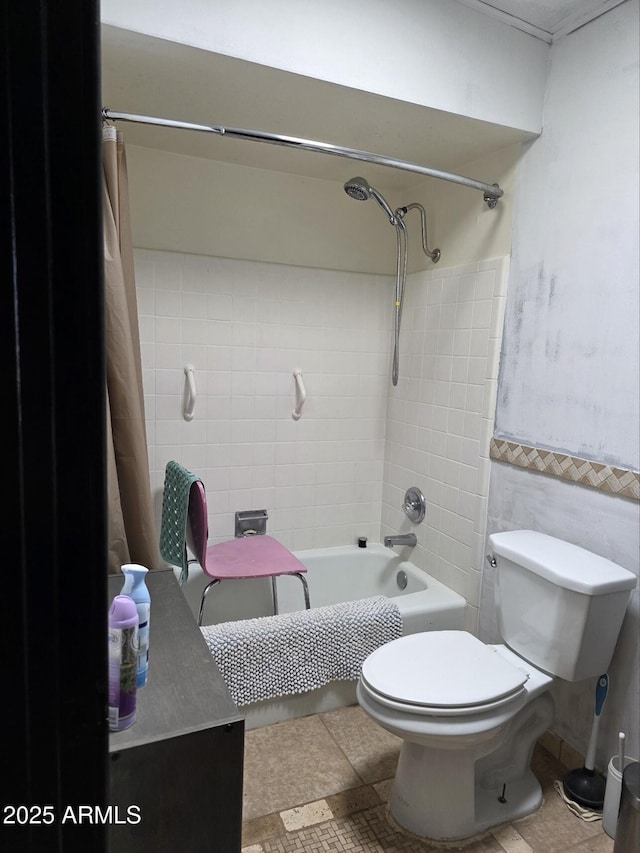 full bath with toilet, tile walls, and bathtub / shower combination