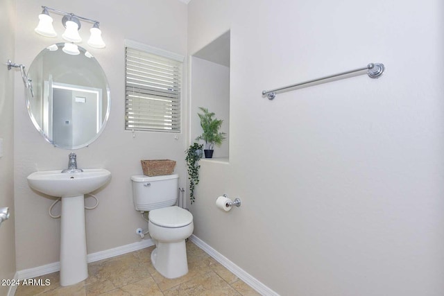 bathroom featuring toilet