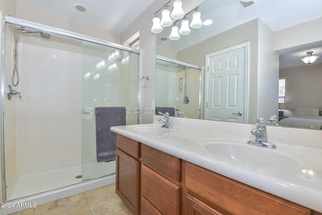 bathroom featuring vanity and an enclosed shower