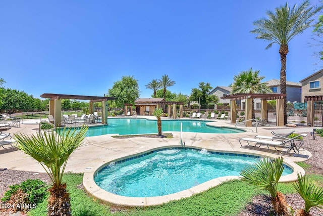 view of swimming pool featuring a pergola and a patio area