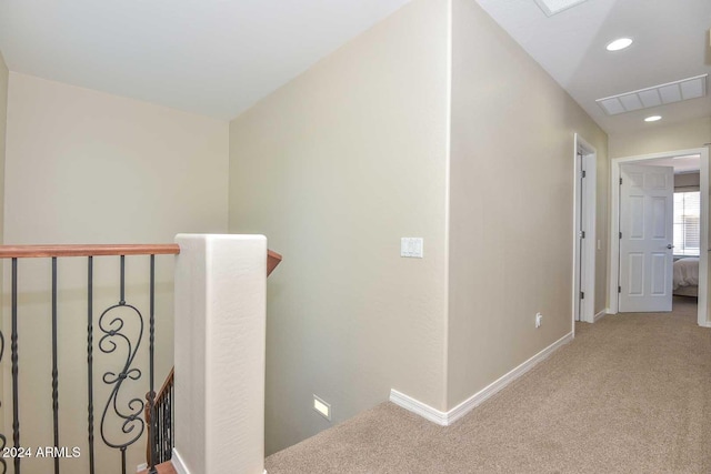 hallway with carpet flooring