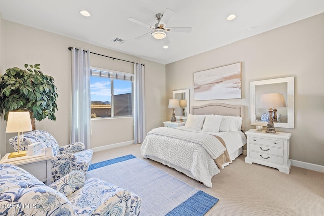 bedroom with light colored carpet and ceiling fan