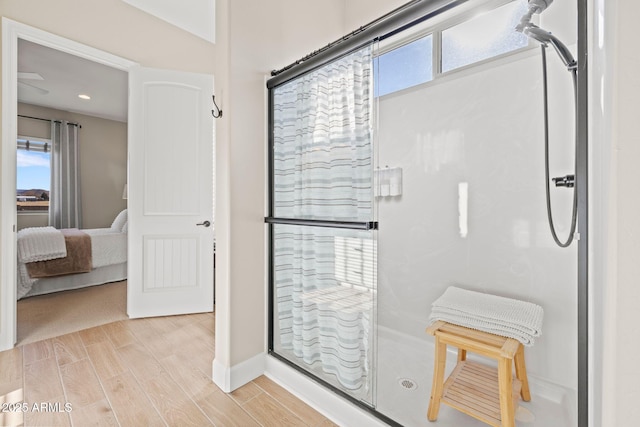 bathroom with hardwood / wood-style floors and a healthy amount of sunlight