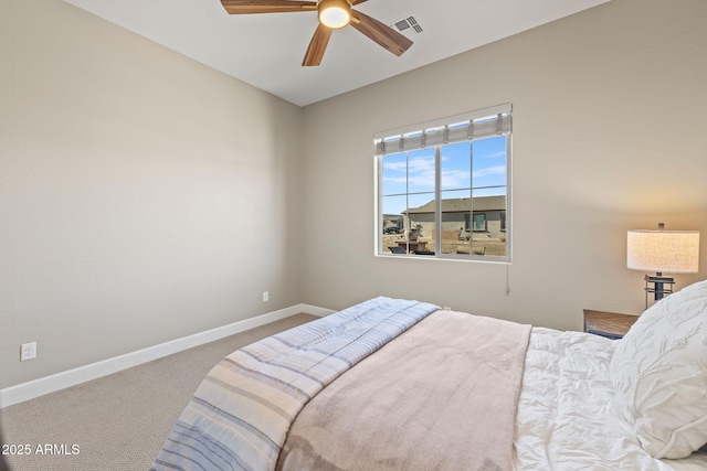 bedroom featuring ceiling fan and carpet