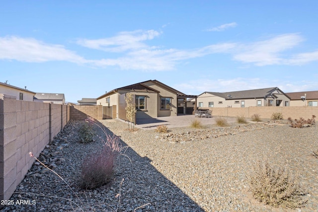 rear view of house featuring a patio area