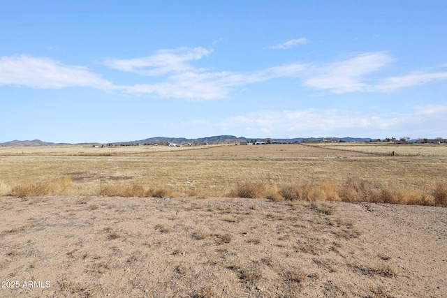 view of landscape with a rural view and a mountain view