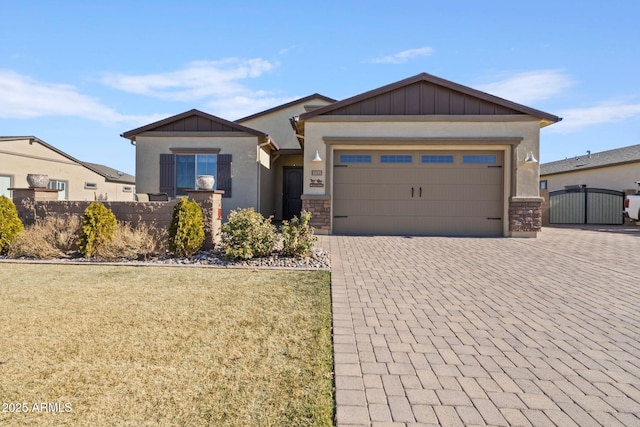 view of front of house featuring a garage and a front lawn