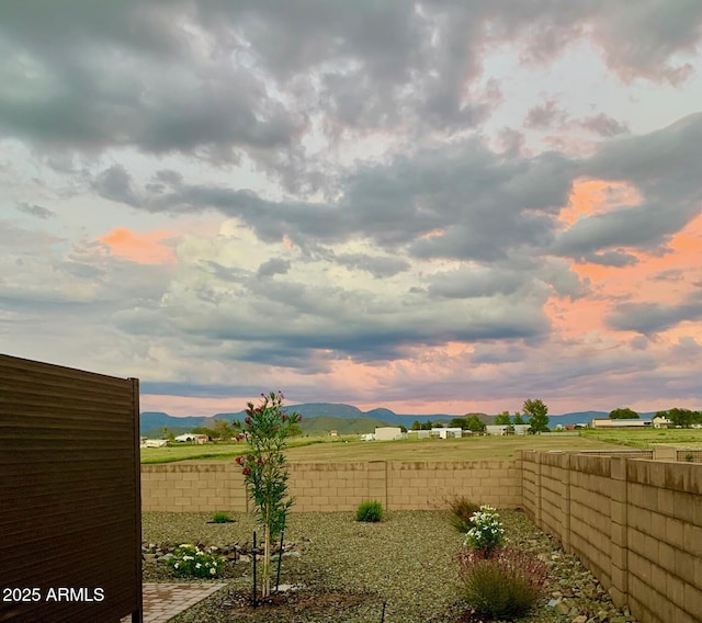 yard at dusk with a mountain view