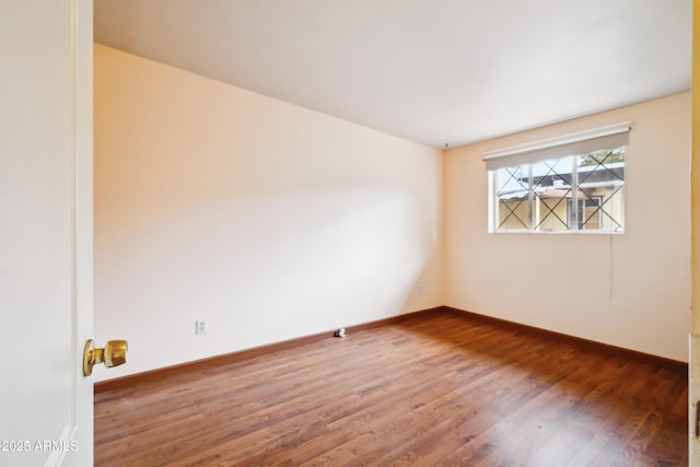 empty room with hardwood / wood-style floors