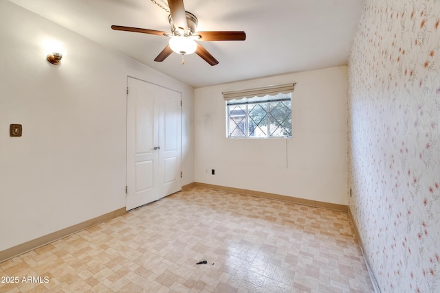 empty room featuring ceiling fan