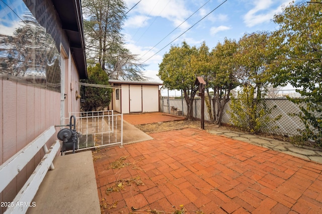 view of patio with a shed