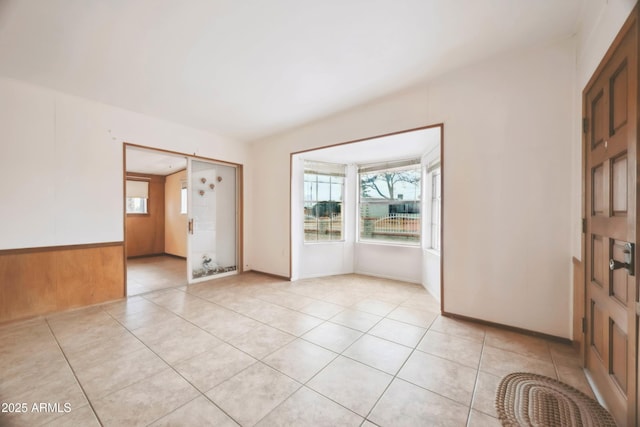 tiled empty room with wooden walls