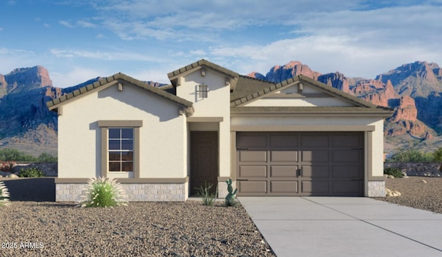 view of front of property with a mountain view and a garage