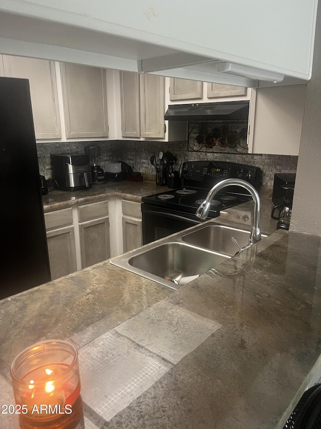 kitchen featuring backsplash, ventilation hood, black appliances, and sink