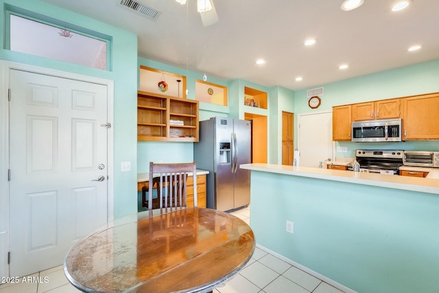 kitchen with a toaster, open shelves, light tile patterned floors, visible vents, and appliances with stainless steel finishes