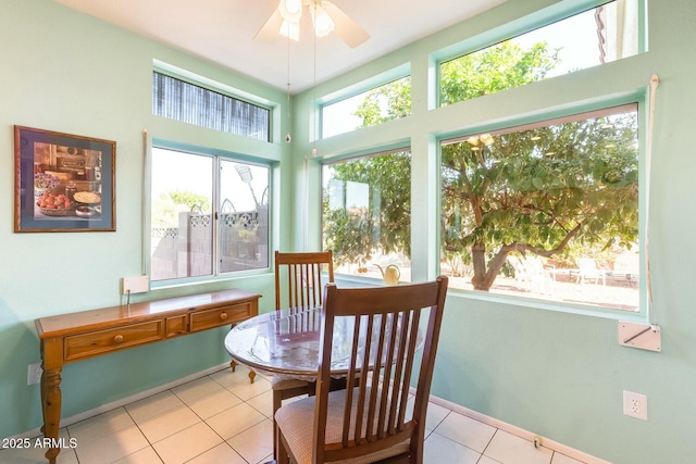 sunroom with a ceiling fan