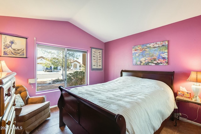 bedroom featuring vaulted ceiling and tile patterned floors