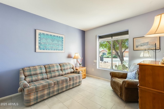 living room featuring light tile patterned flooring and baseboards