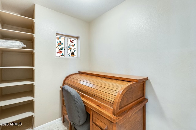 office area featuring baseboards and tile patterned floors