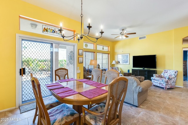 dining room with visible vents, baseboards, and ceiling fan with notable chandelier