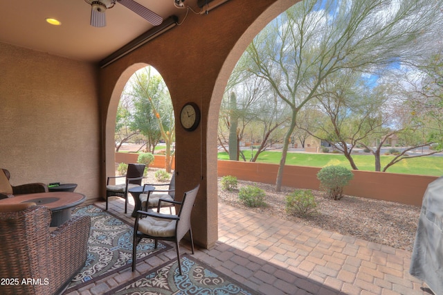 view of patio featuring a ceiling fan