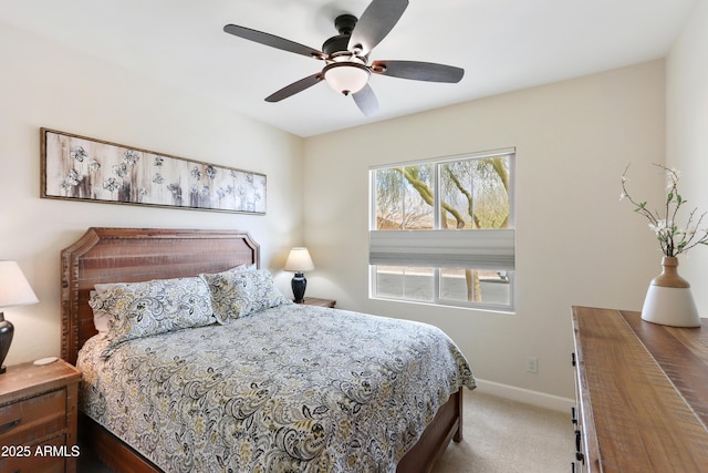 carpeted bedroom with baseboards and ceiling fan