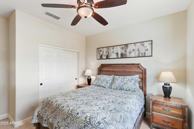 bedroom featuring visible vents, baseboards, a closet, and a ceiling fan