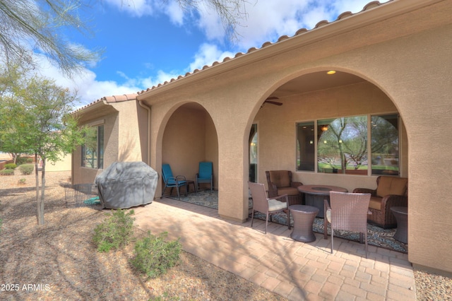 view of patio / terrace with an outdoor living space and area for grilling