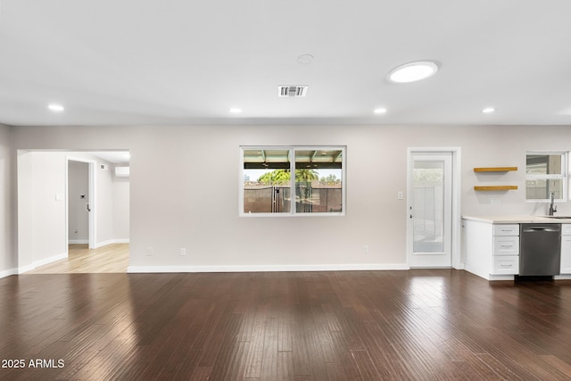 1911 E Lawrence Rd, Phoenix, AZ 85016 - unfurnished living room with wood finished floors and recessed lighting