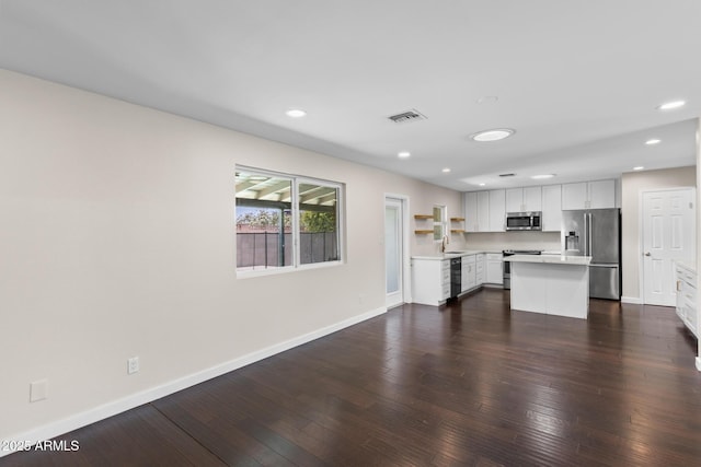 1911 E Lawrence Rd, Phoenix, AZ 85016 - unfurnished living room with dark wood finished floors and recessed lighting