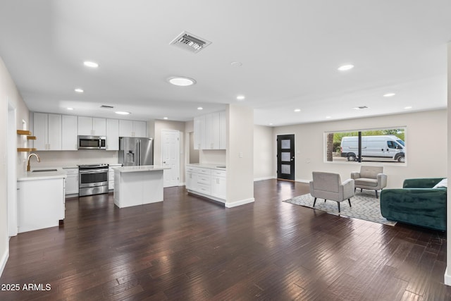 1911 E Lawrence Rd, Phoenix, AZ 85016 - living area featuring dark wood finished floors and recessed lighting