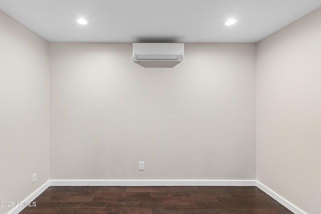 1911 E Lawrence Rd, Phoenix, AZ 85016 - below grade area featuring a wall unit AC, dark wood finished floors, and recessed lighting