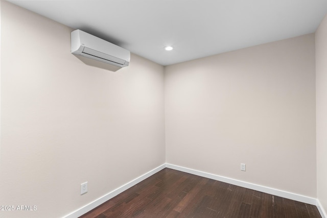 1911 E Lawrence Rd, Phoenix, AZ 85016 - spare room with a wall mounted air conditioner, dark wood-type flooring, and recessed lighting