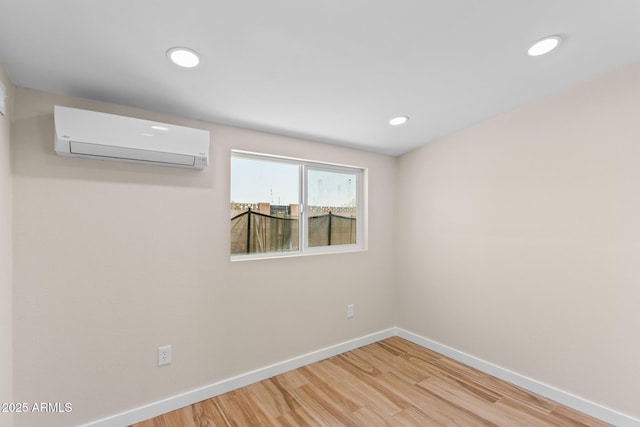 1911 E Lawrence Rd, Phoenix, AZ 85016 - empty room featuring a wall mounted air conditioner, light wood-type flooring, and recessed lighting