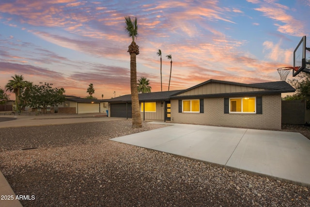 1911 E Lawrence Rd, Phoenix, AZ 85016 - ranch-style home with concrete driveway and brick siding