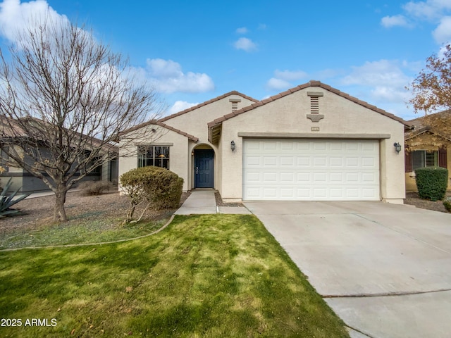 view of front of home featuring a garage and a front yard