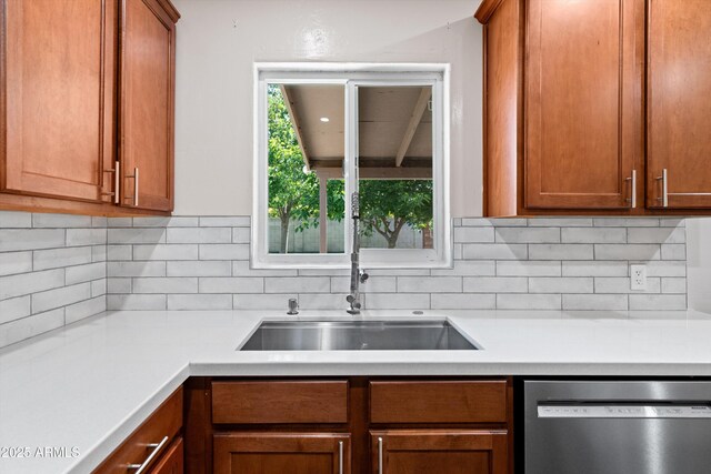 5709 N 16th St, Phoenix, AZ 85016 - kitchen featuring brown cabinets, dishwasher, light countertops, and backsplash