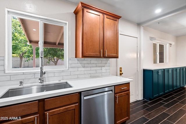 5709 N 16th St, Phoenix, AZ 85016 - kitchen featuring stainless steel dishwasher, wood finish floors, light countertops, brown cabinets, and decorative backsplash