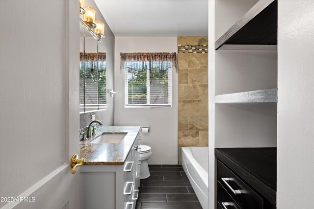 5709 N 16th St, Phoenix, AZ 85016 - full bath featuring vanity, wood finish floors, and toilet