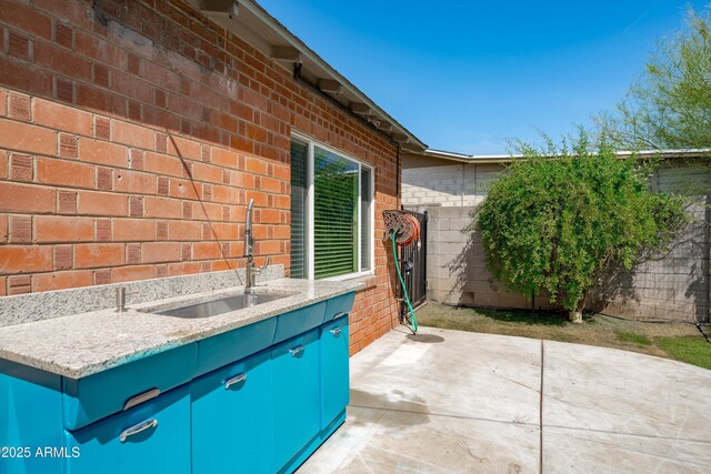 5709 N 16th St, Phoenix, AZ 85016 - view of patio with a sink and fence