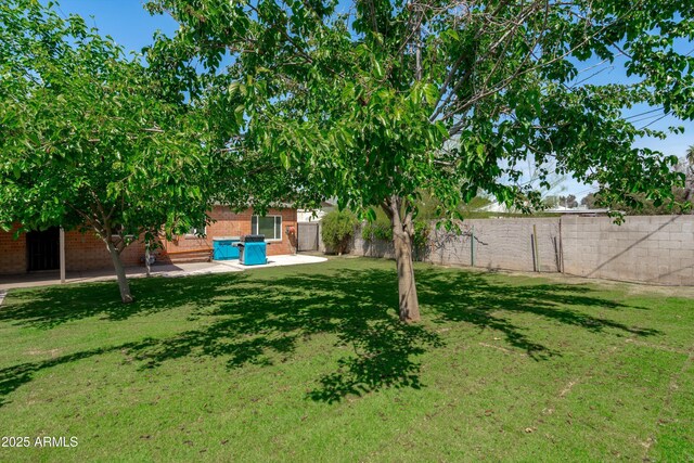 5709 N 16th St, Phoenix, AZ 85016 - view of yard featuring a patio area and a fenced backyard