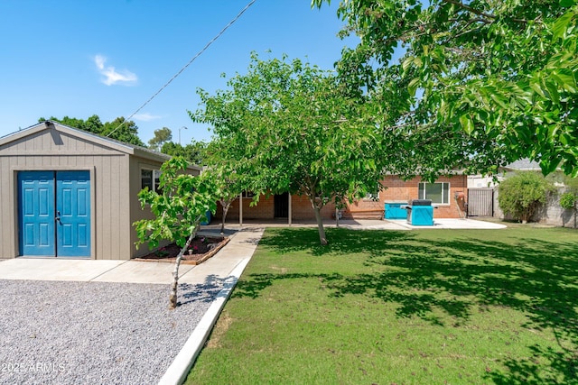 5709 N 16th St, Phoenix, AZ 85016 - view of yard with a patio, an outbuilding, and fence