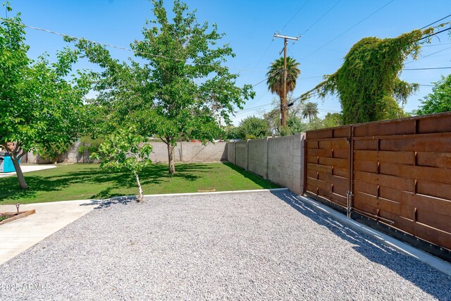 5709 N 16th St, Phoenix, AZ 85016 - view of yard featuring a patio area and a fenced backyard