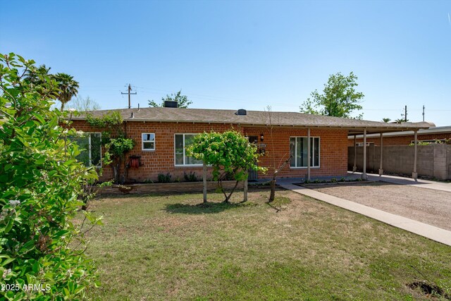 5709 N 16th St, Phoenix, AZ 85016 - back of property with a yard and brick siding