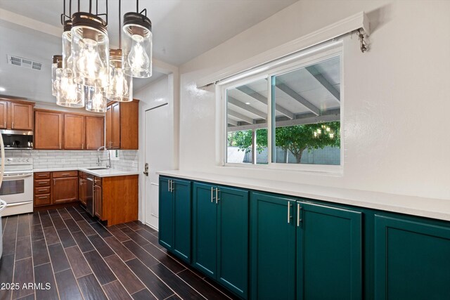 5709 N 16th St, Phoenix, AZ 85016 - kitchen with tasteful backsplash, visible vents, a sink, light countertops, and stainless steel appliances