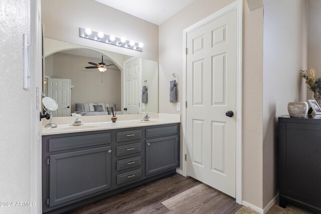 bathroom featuring vanity, hardwood / wood-style floors, and ceiling fan